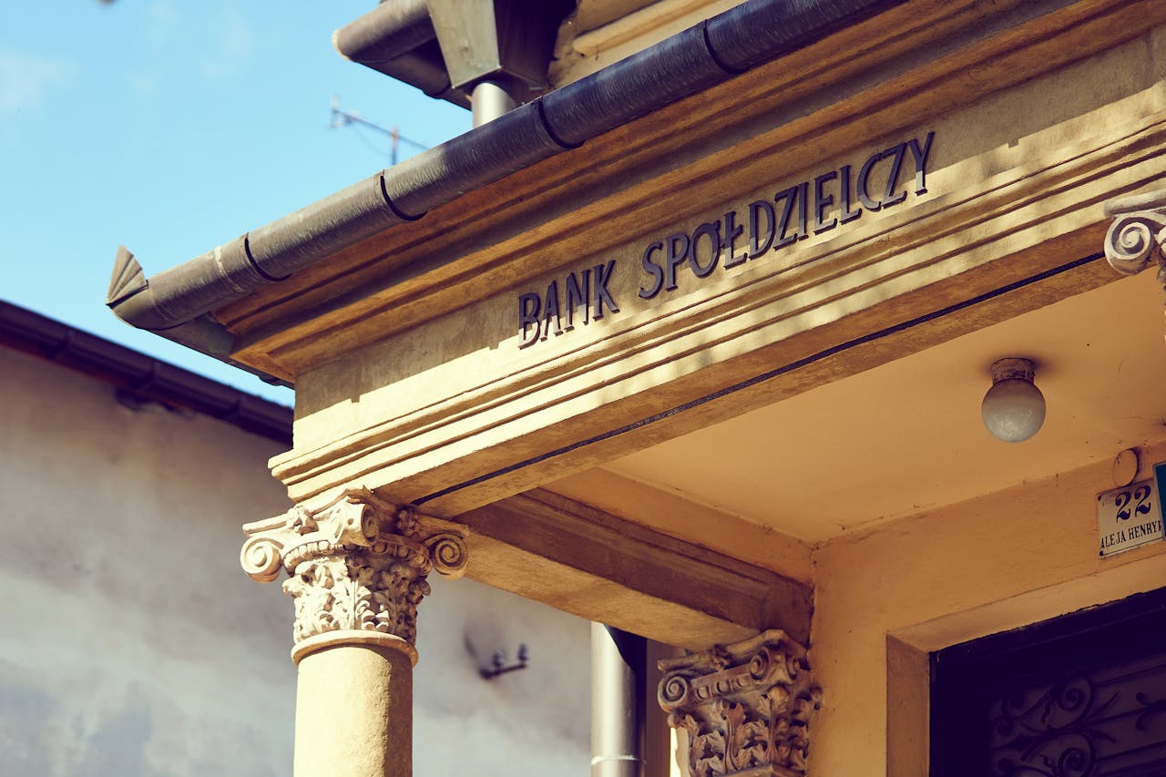 services-03 Detailed view of a historic Polish bank facade with classic architectural columns.